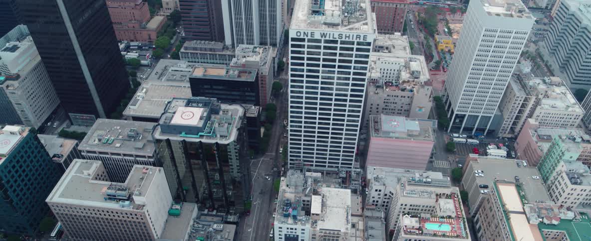 Aerial view of a large city and traffic moving through it