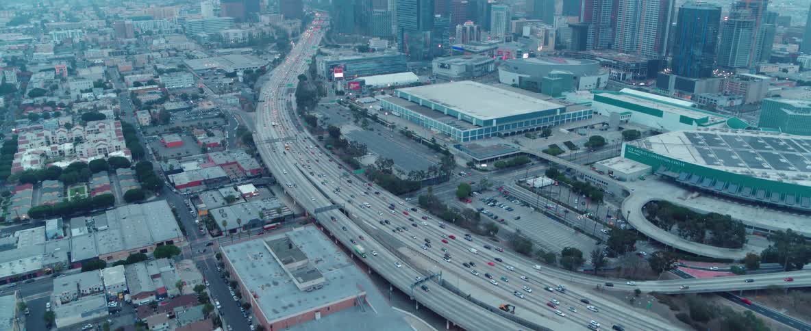 Cars drive on a city highway