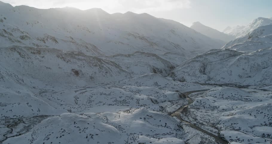 Snow-covered mountains at sunset
