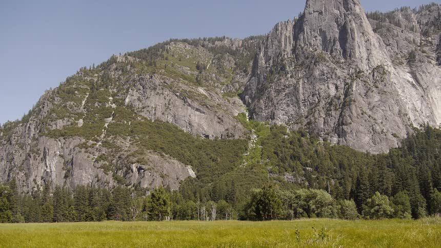Large mountain before a green field