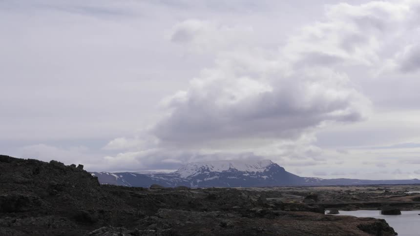 Clouds passing over a mountain