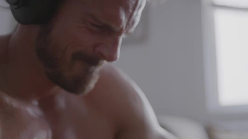 A man grimaces while working out