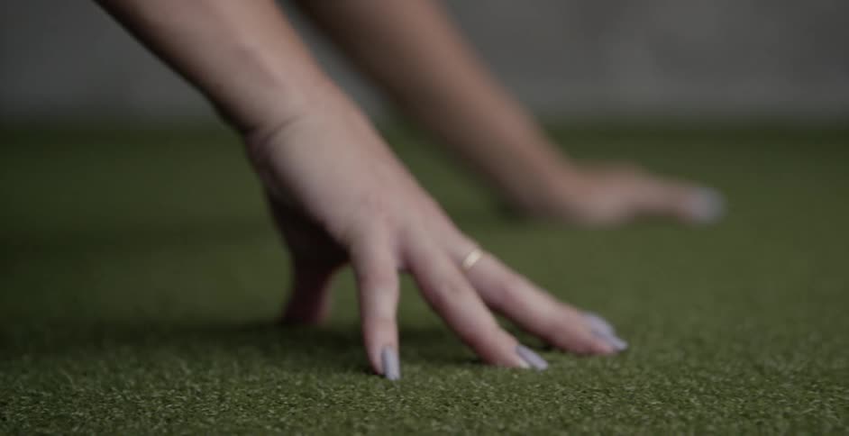 Woman stretches while doing floor exercise