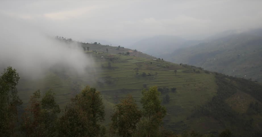 Clouds float above a mountainside
