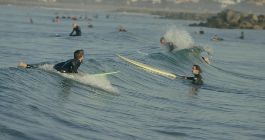 Small waves greeting surfers in the water