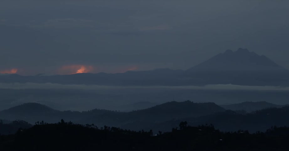 The sun sets over mountains