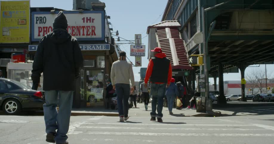 Pedestrians cross a city street