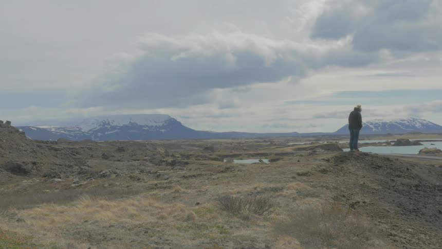 A person standing on a hill