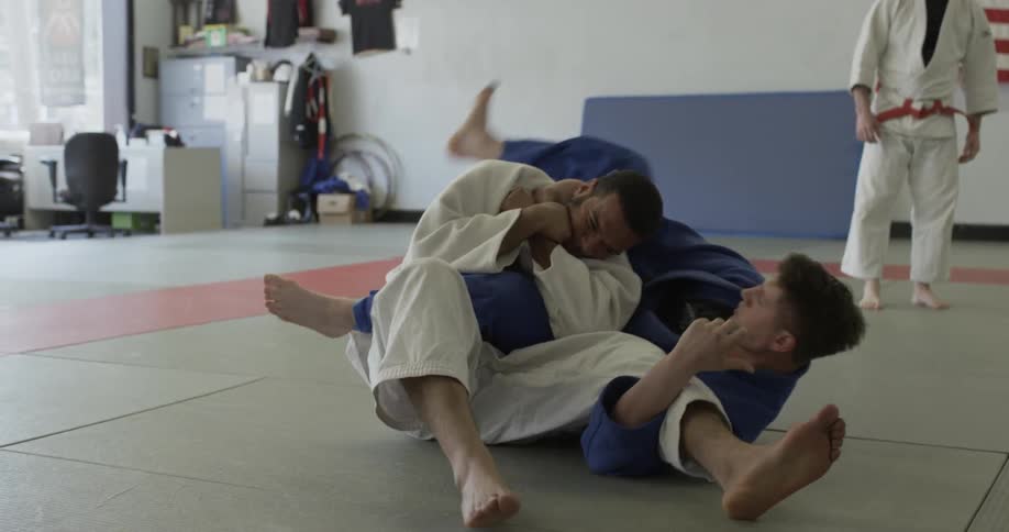 Two martial artists are sparring