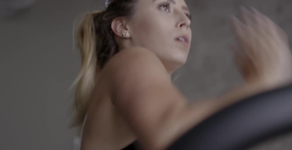 A woman runs on a treadmill