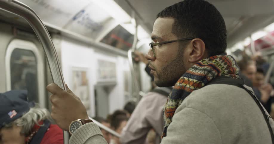 Commuters ride on a subway train