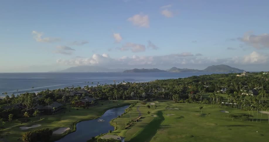 Green golf course near the ocean
