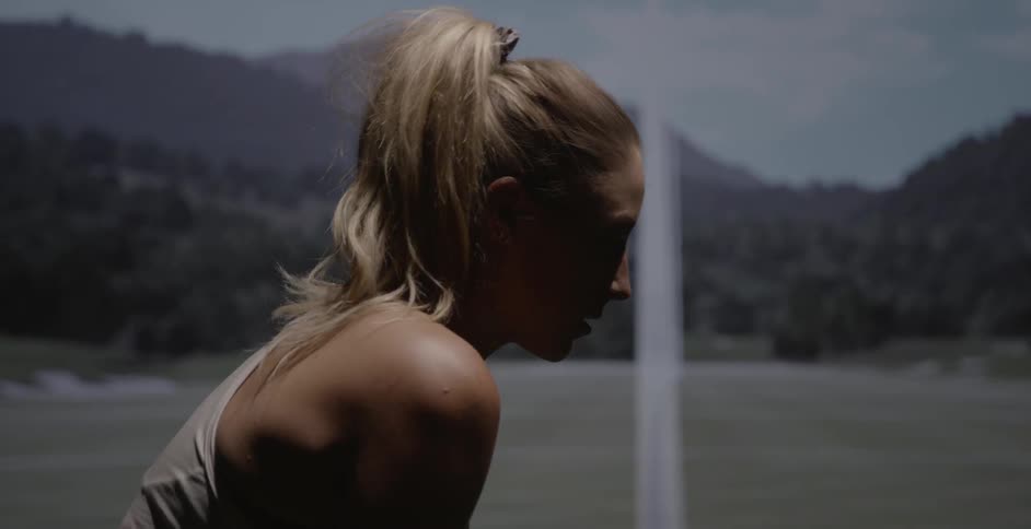 A woman golfs on a golf course