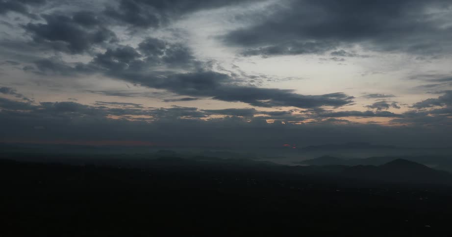 The sun is slowly rising above a plains