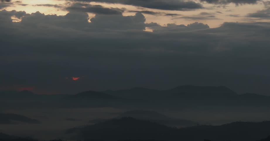 The clouds are dark as the sun finally sets