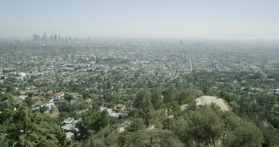 A line of haze forms across a sprawling urban area
