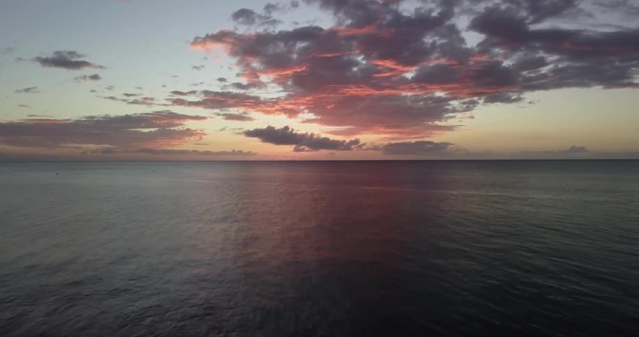 The sun sets over an ocean