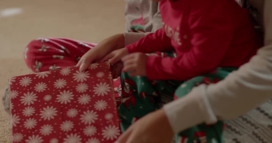 A family opens christmas presents