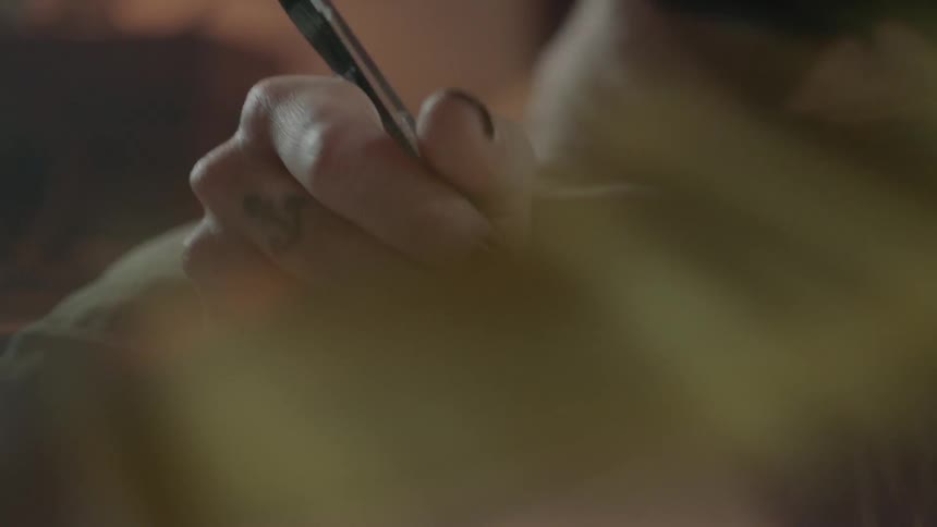 A woman writes in a notebook