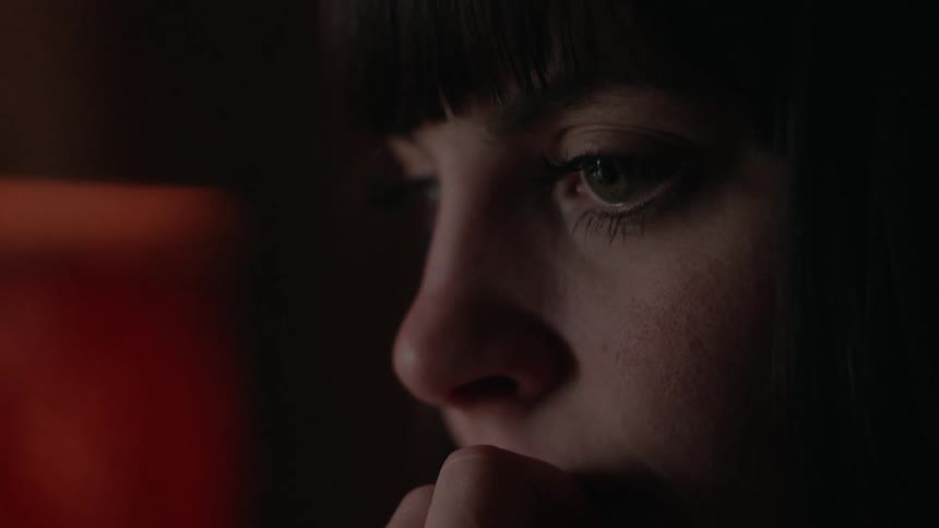 Woman stares into space and thinks