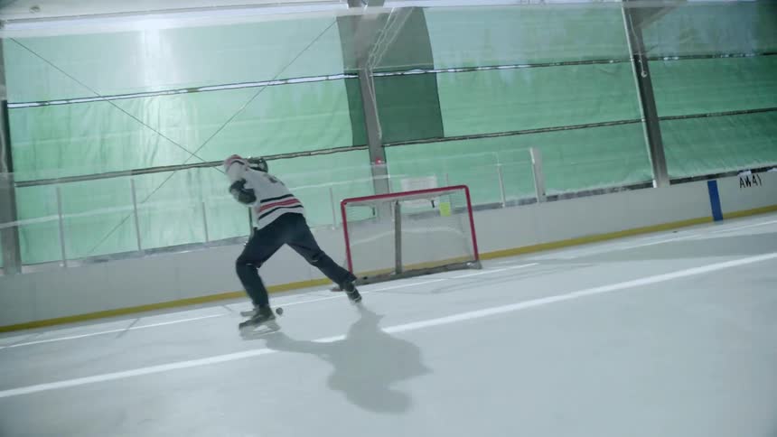 A hockey player practices on the nice