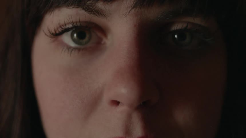 Woman's face with staring eyes