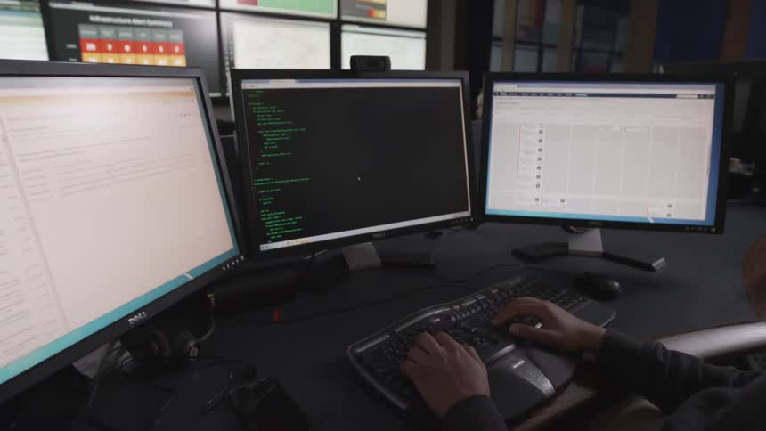A person using multiple screens
