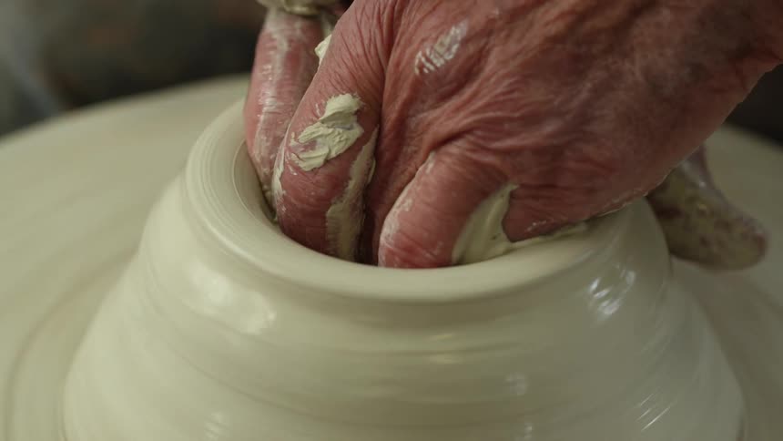 A person making pottery