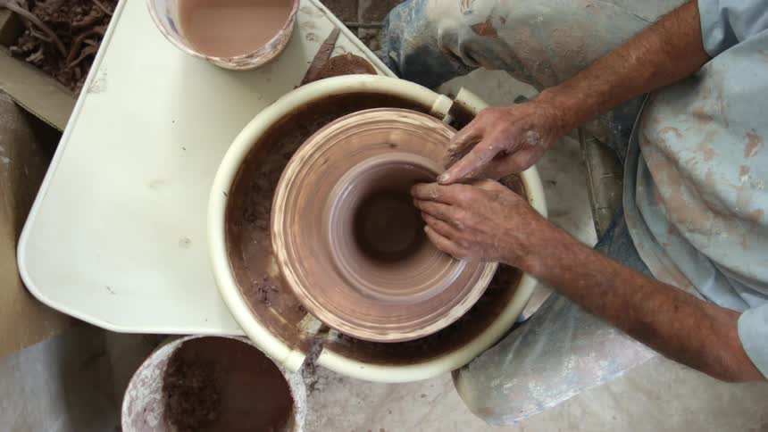 A person making pottery