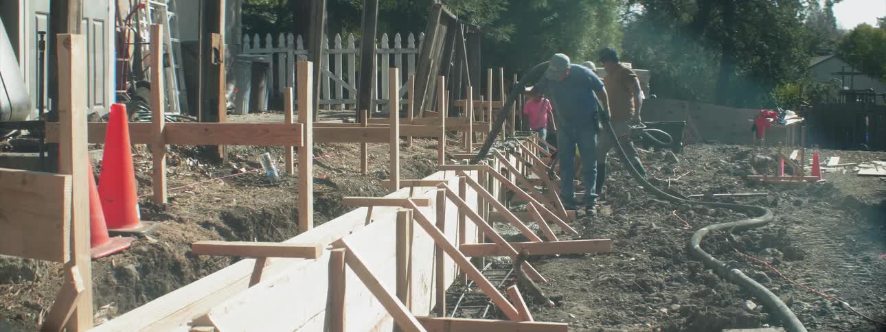 Construction workers work at a job site