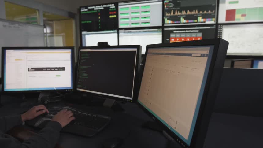 A person using multiple screens
