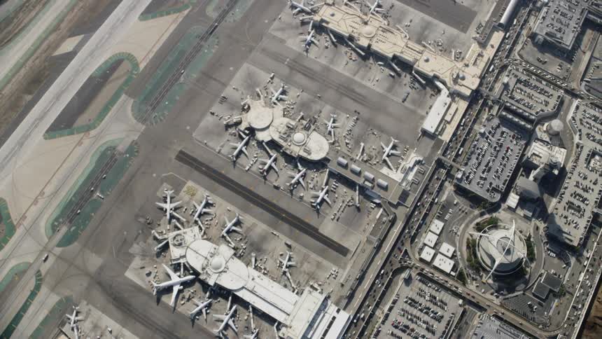 Airplanes are parked at an airport
