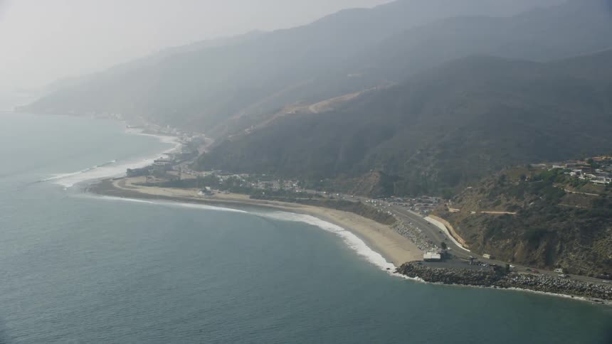 The water is calm along the coast below