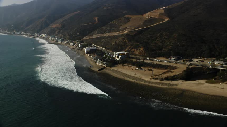 Ocean waves flow towards a coastline