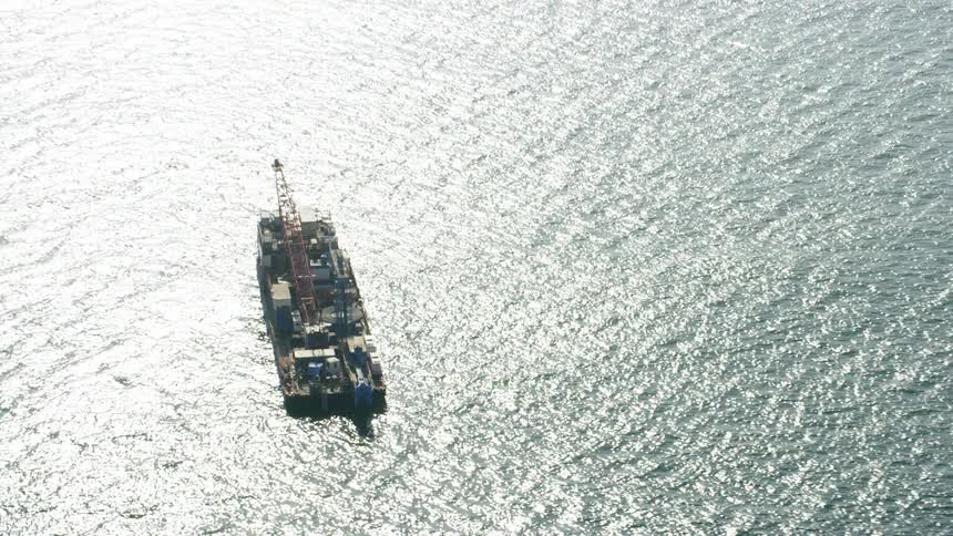 Large rig in the middle of a large body of water