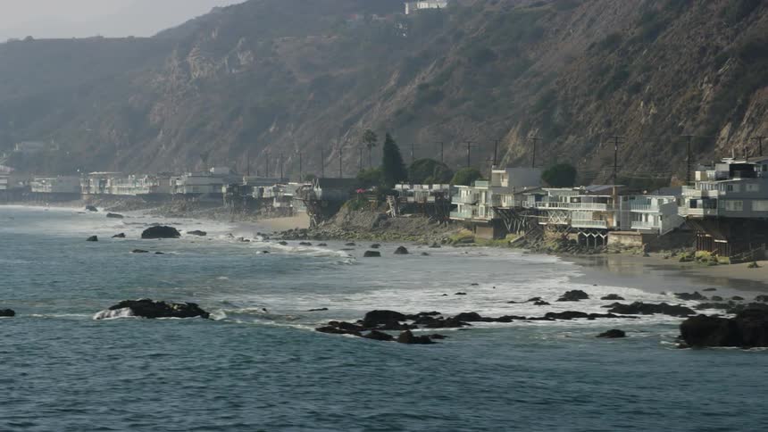 The shore is lined with mountains and homes