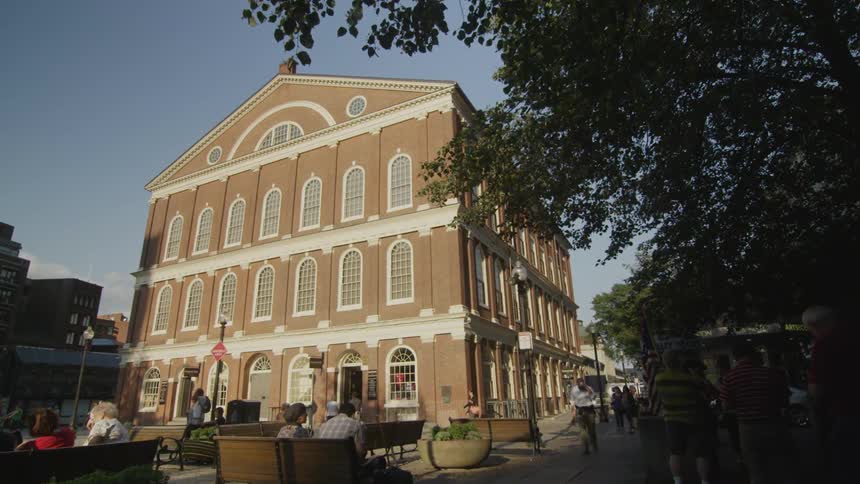 Large building with people walking around it