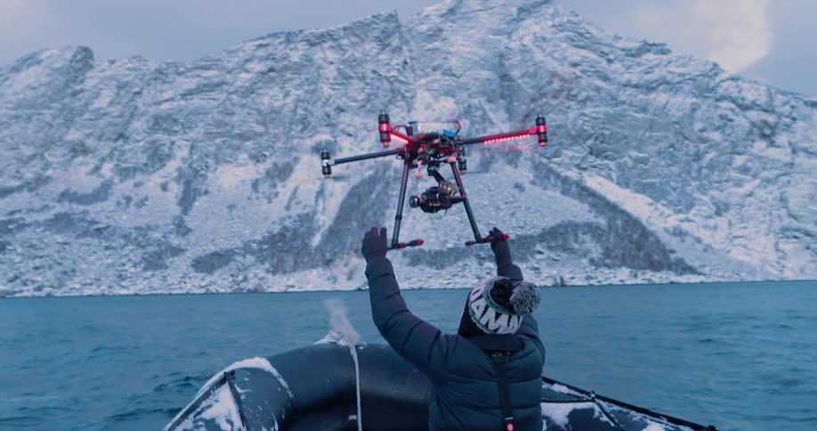 Person on a raft catches a drone