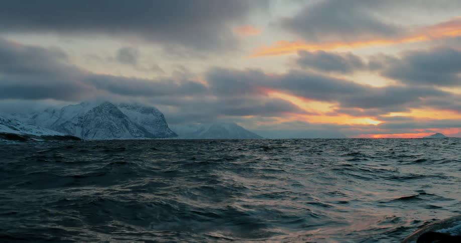 Large ocean waves at sunset