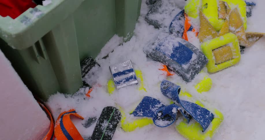 Snow covers equipment on a boat
