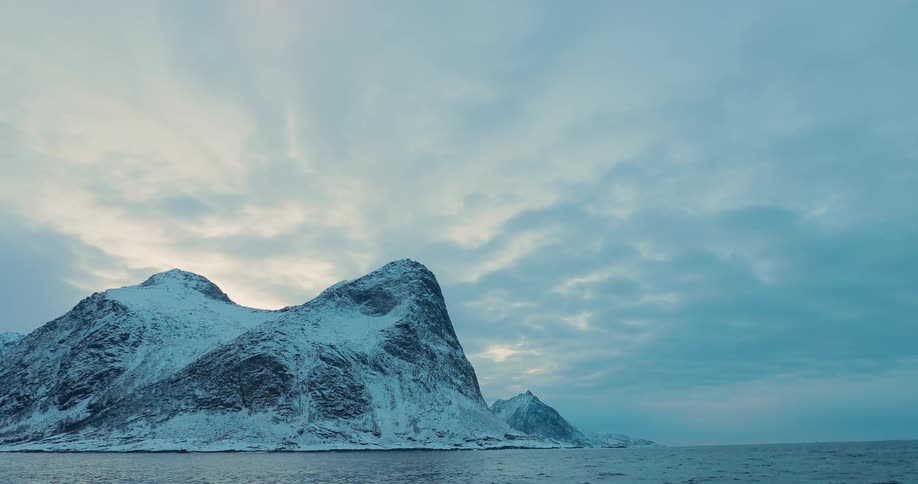 Snow covers a coastal mountain