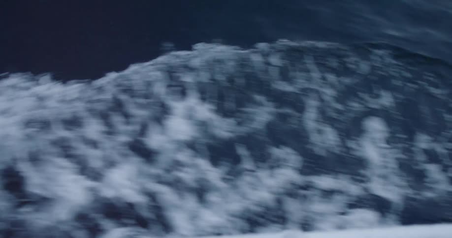 A boat sails on the ocean
