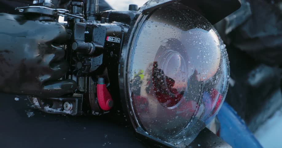 Water droplets bead on a plastic camera cover