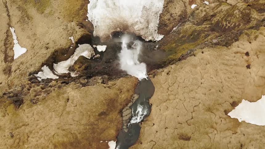 Small stream splashing off a cliff