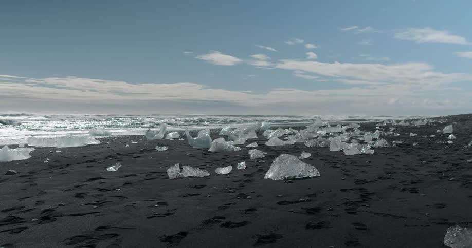 Water splashing to an ice covered shore