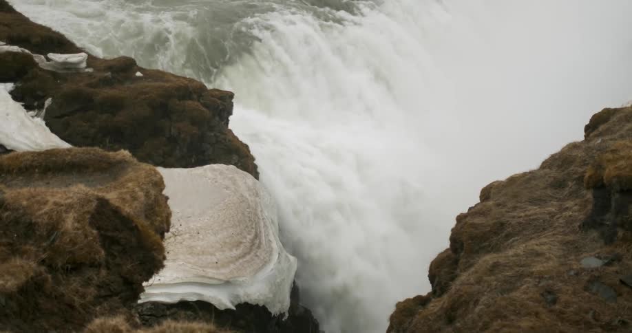 A river gushes over a waterfall