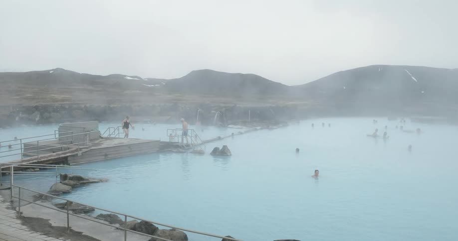People swimming in blue lagoon