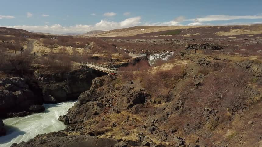 Water flows quickly between the hills