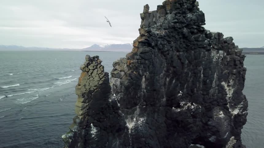Large rock formation near a body of water