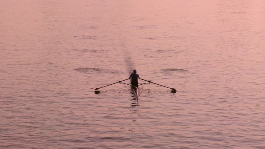 A person riding in a canoe